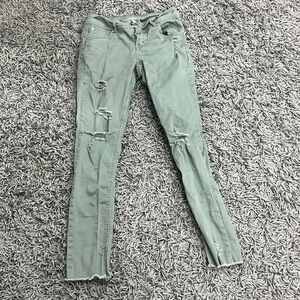 skinny jeans- grayish-green- rips- frayed at bottom- above ankles- size 0
